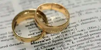 two gold-colored rings on paper