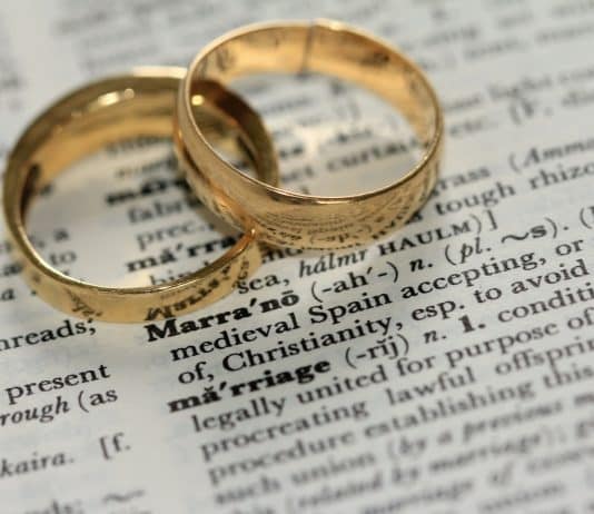 two gold-colored rings on paper